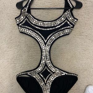 Norma  Kamali One piece bathing suit and never worn serious inquiries only